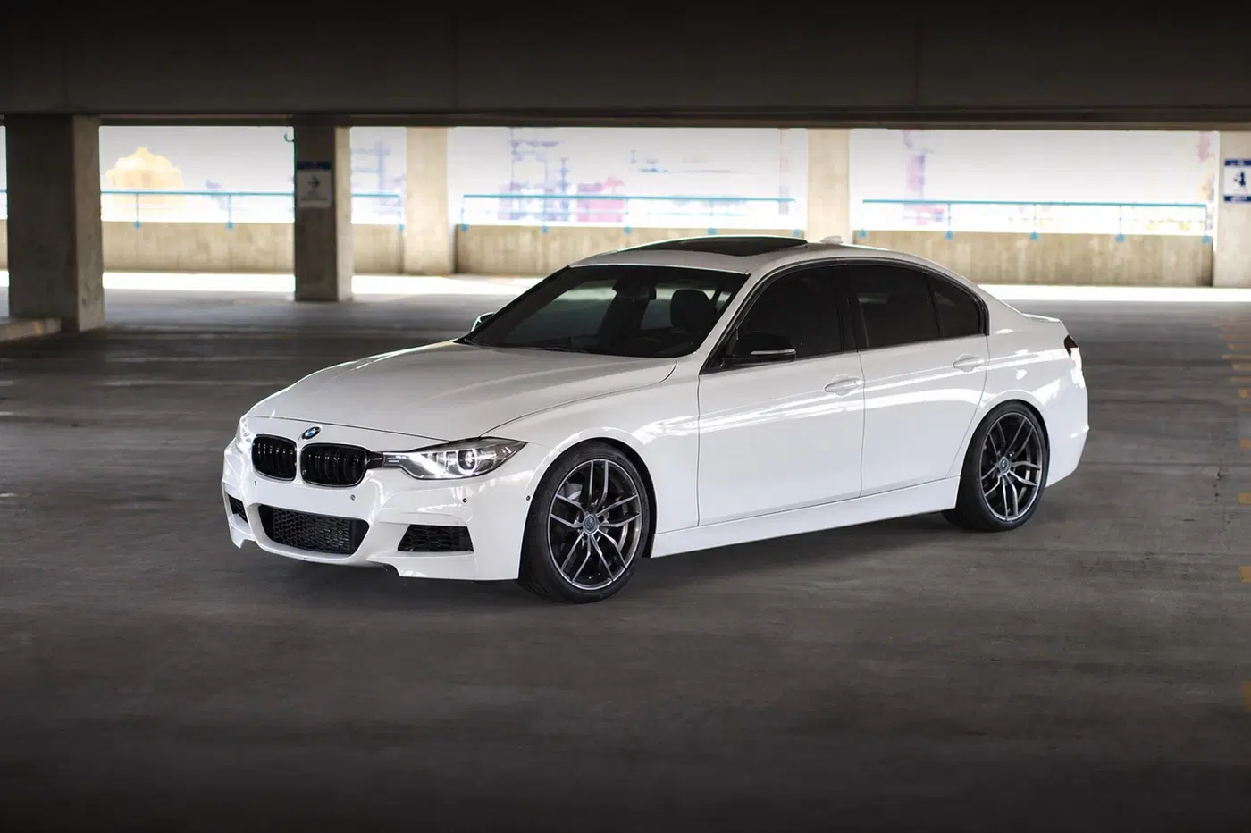 AI-generated view of a 2012 BMW 328i with Niche Vossos wheels