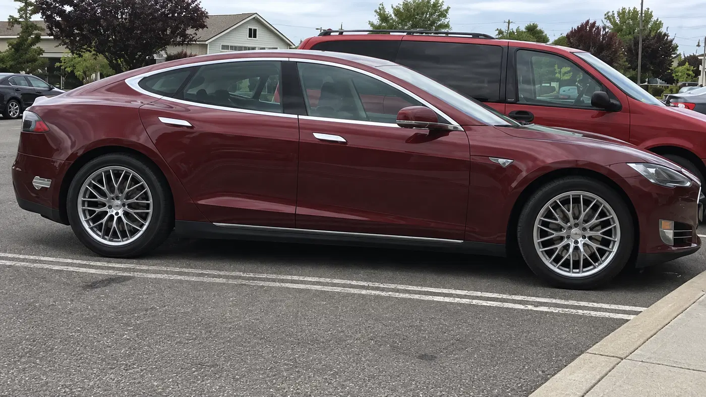 AI-generated view of a 2012 Tesla Model S Signature Performance P85 with TSW Snetterton wheels