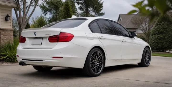 AI-generated view of a 2014 BMW 328i xDrive Sportline with VMR V801 wheels