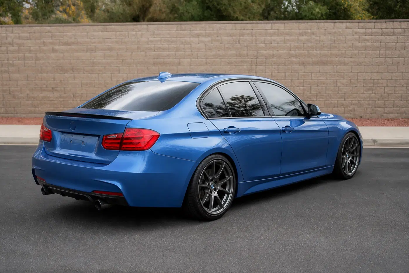 AI-generated view of a 2015 BMW 335i M Sport with APEX EC-7 wheels