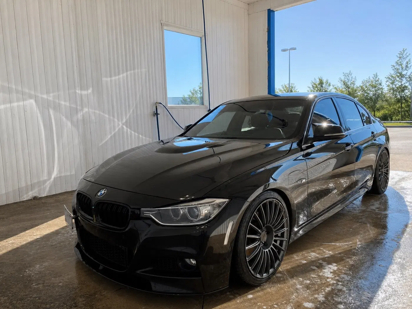 AI-generated view of a 2015 BMW 335i xDrive 8AT with Rotiform BUC wheels
