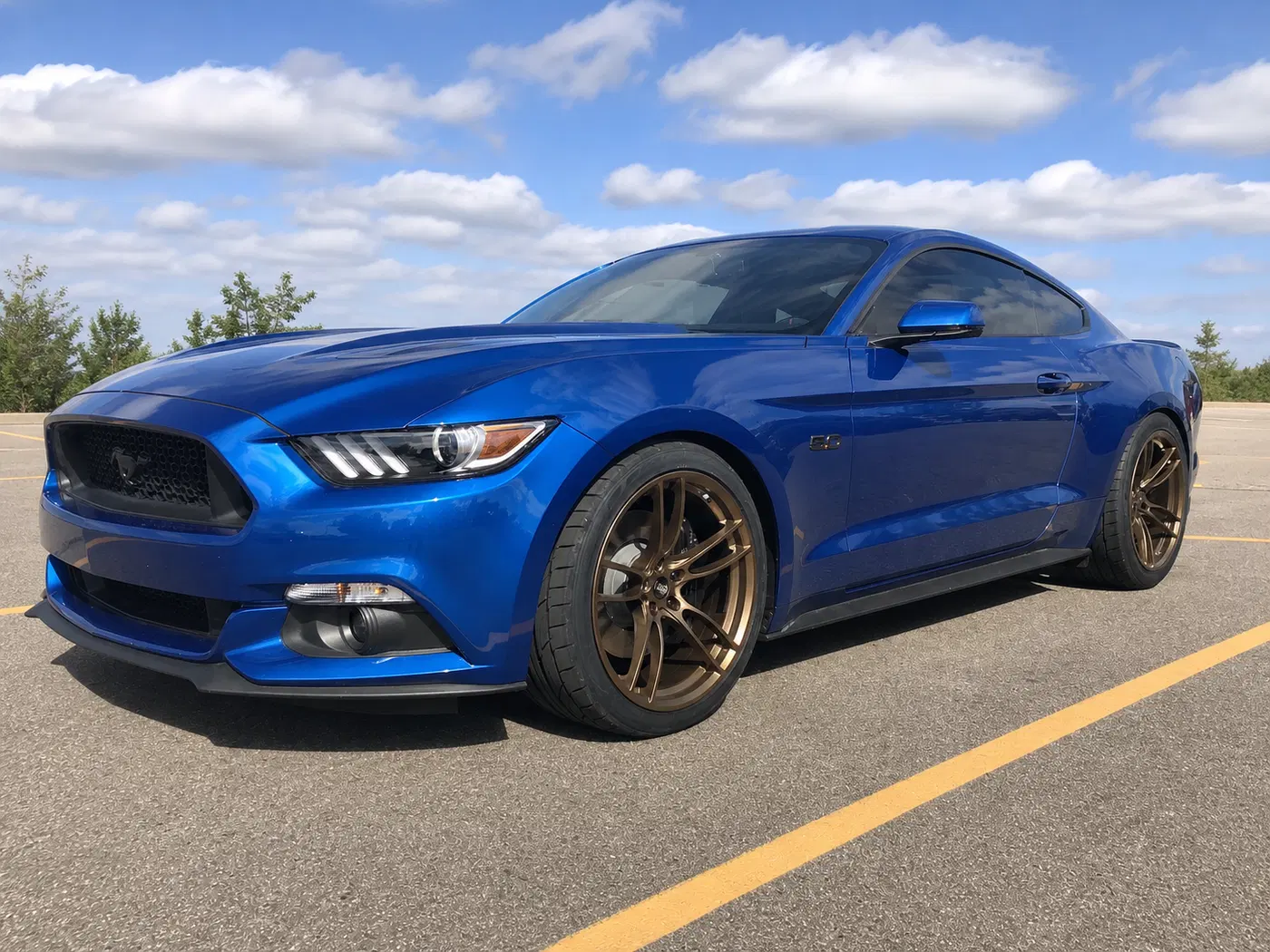 AI-generated view of a 2015 Ford Mustang GT with P51 Wheels N/A wheels