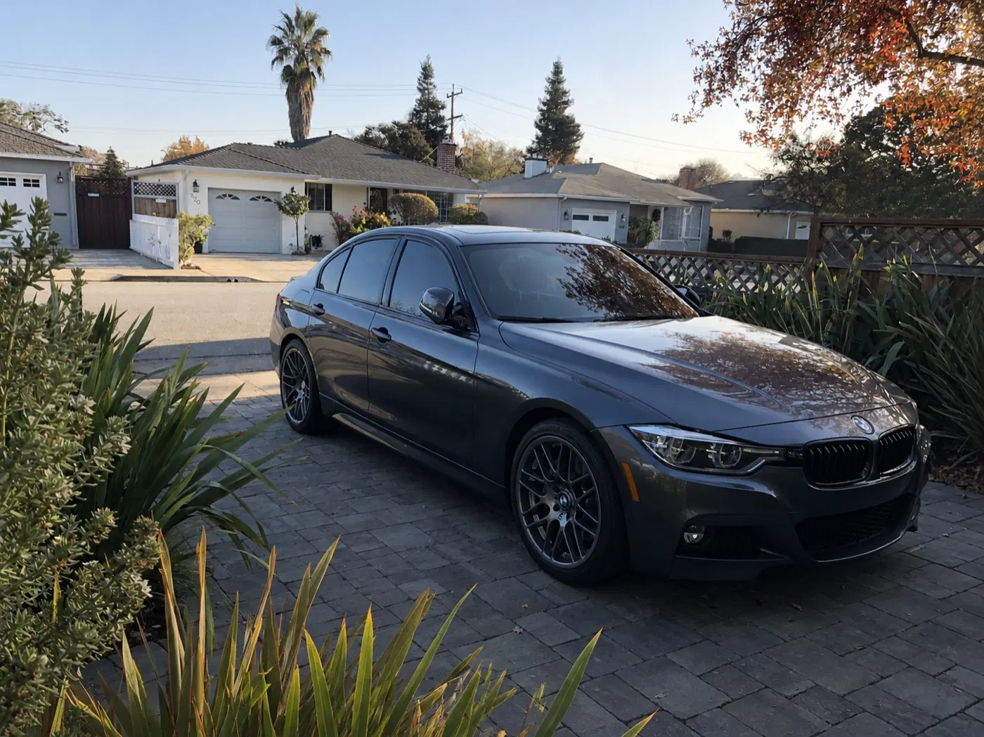 AI-generated view of a 2016 BMW 340i M Sport with VMR V703 wheels