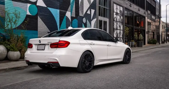 AI-generated view of a 2016 BMW 340i xDrive M Sport with VMR V703 wheels
