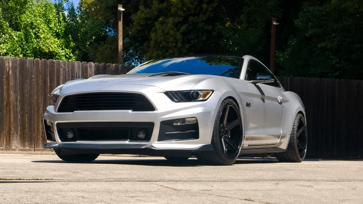 AI-generated view of a 2016 Ford Mustang GT/CS Premium with KMC District wheels