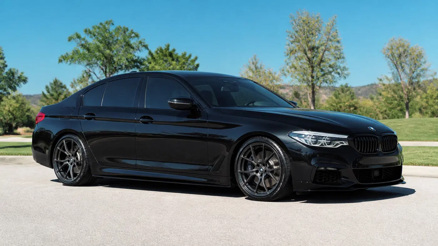 AI-generated view of a 2017 BMW 540i with Vorsteiner VFF-103 wheels