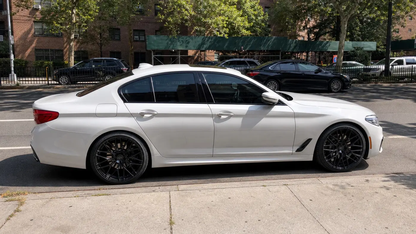 AI-generated view of a 2018 BMW 540i xDrive with Rohana N/A wheels