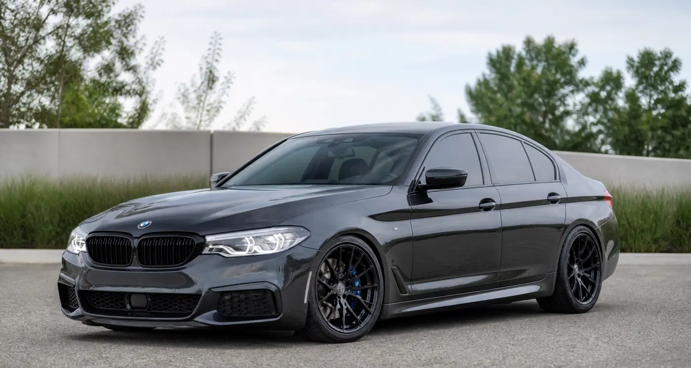 AI-generated view of a 2018 BMW M550 with Stance SF03 wheels