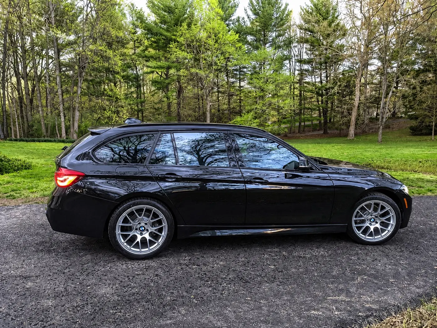 AI-generated view of a 2019 BMW 330i xDrive Sport Wagon with APEX EC-7 wheels