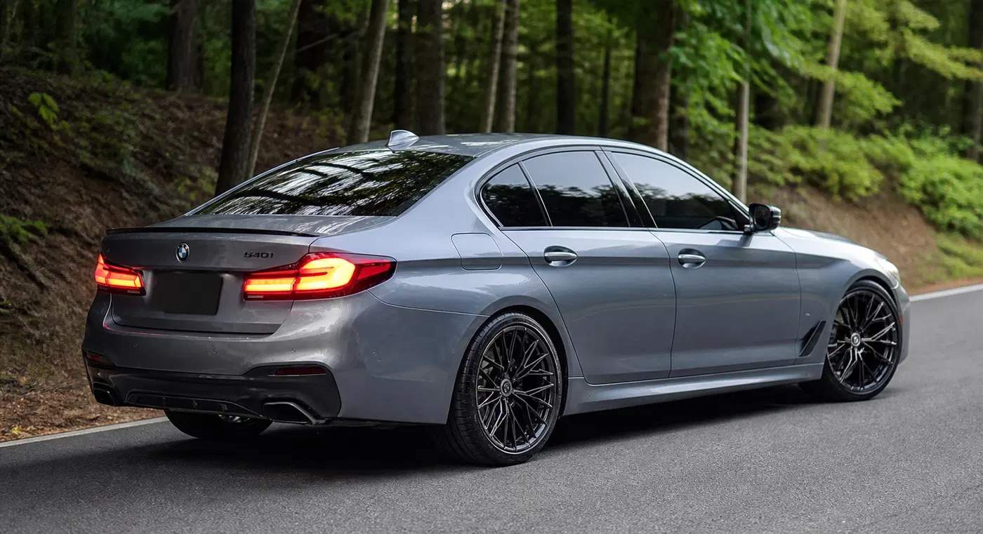 AI-generated view of a 2019 BMW 540i with HRE FF28 wheels