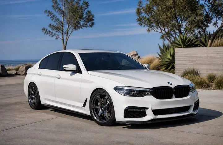 AI-generated view of a 2021 BMW M550i with Rays Gram Lights 57DR wheels