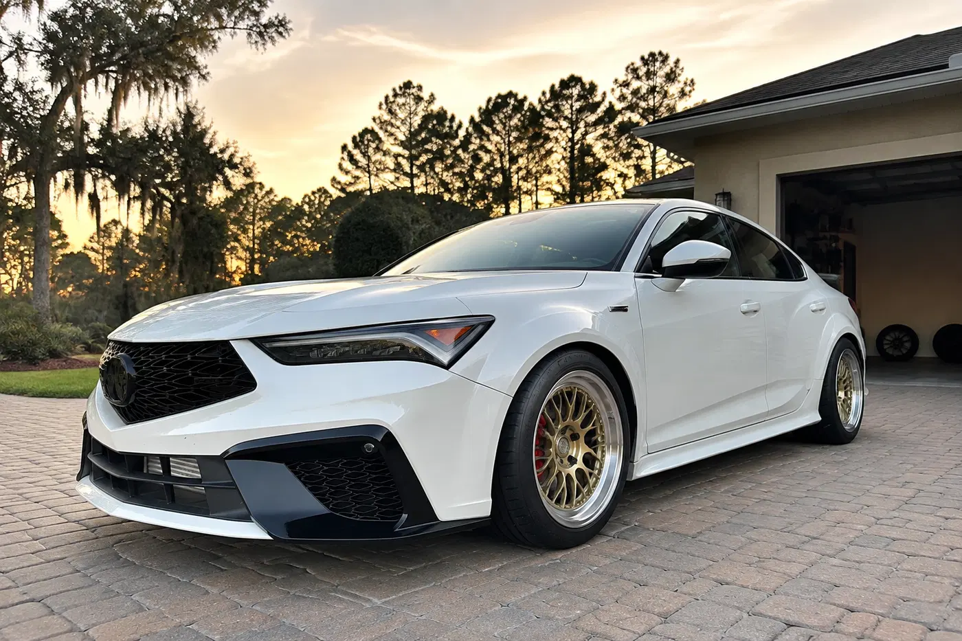 AI-generated view of a 2024 Acura Integra Type S with Apex ML-10RT wheels