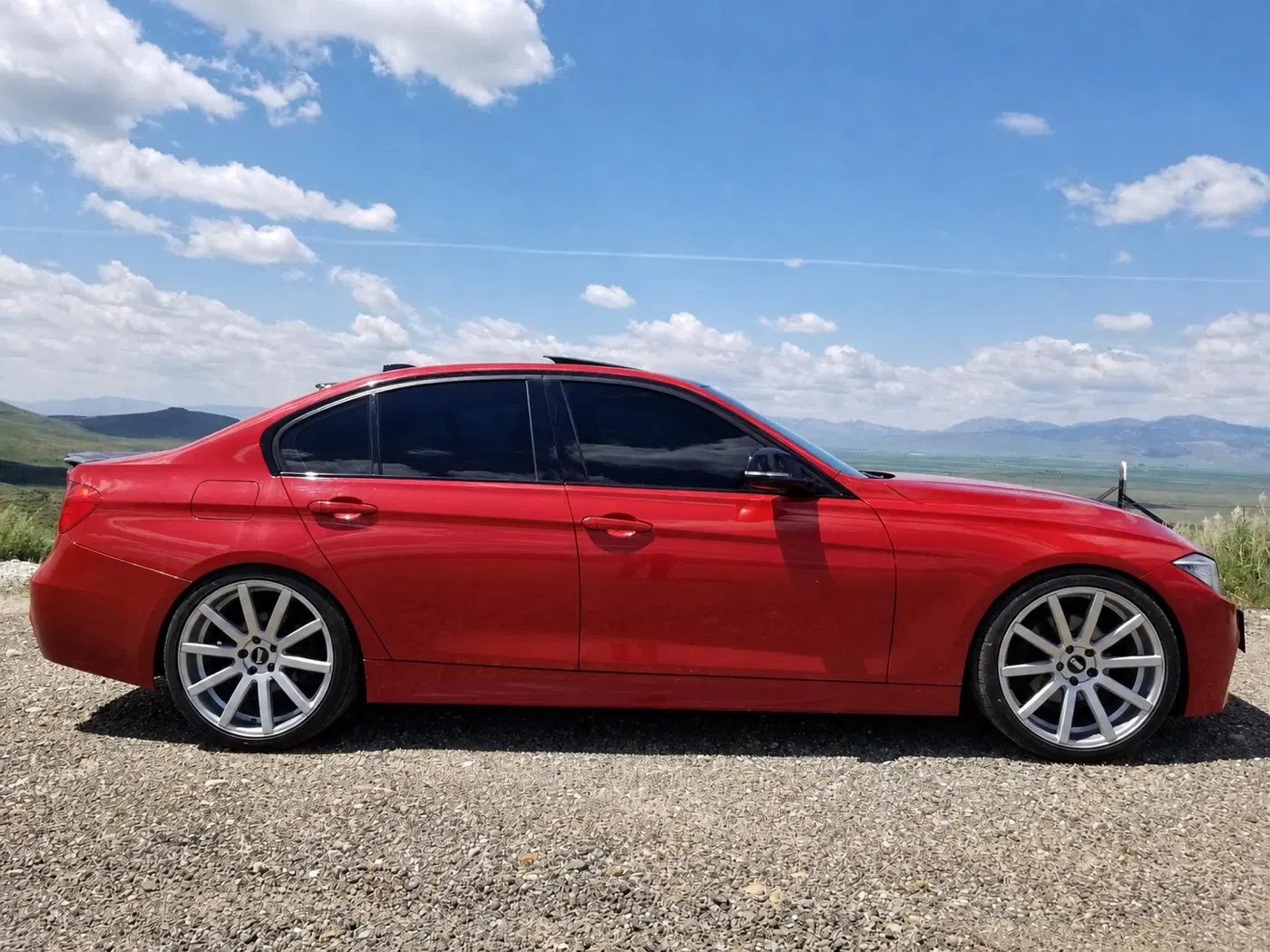 AI-generated view of a 2013 BMW 328i xDrive M Sport with VMR V702 wheels