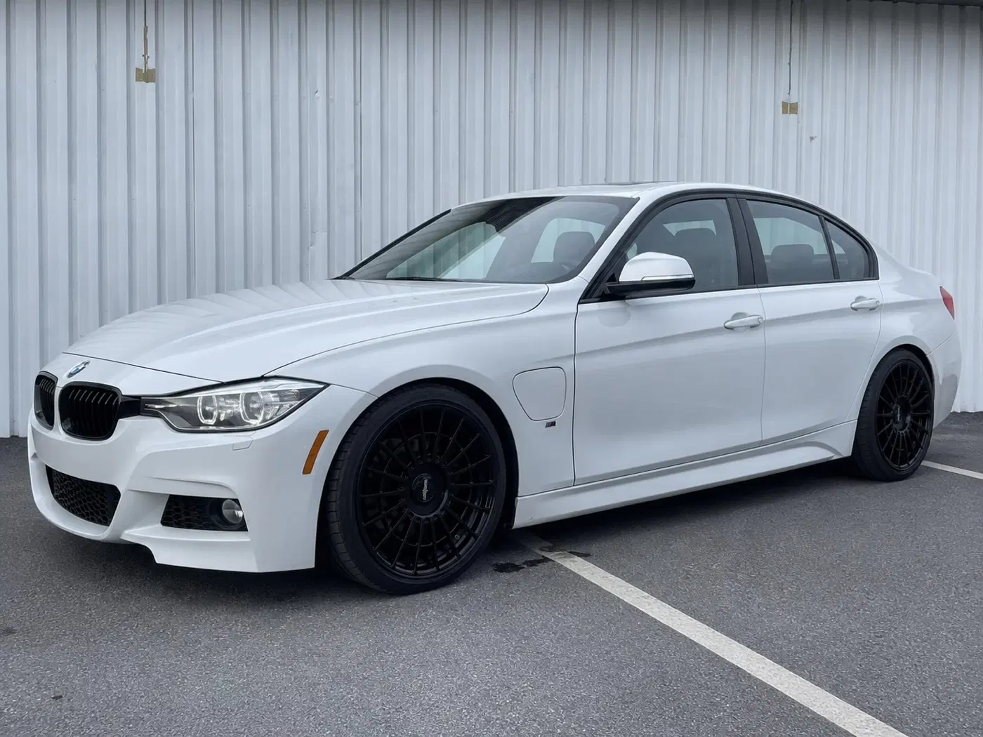 AI-generated view of a 2017 BMW 330e with Rotiform LAS-R wheels