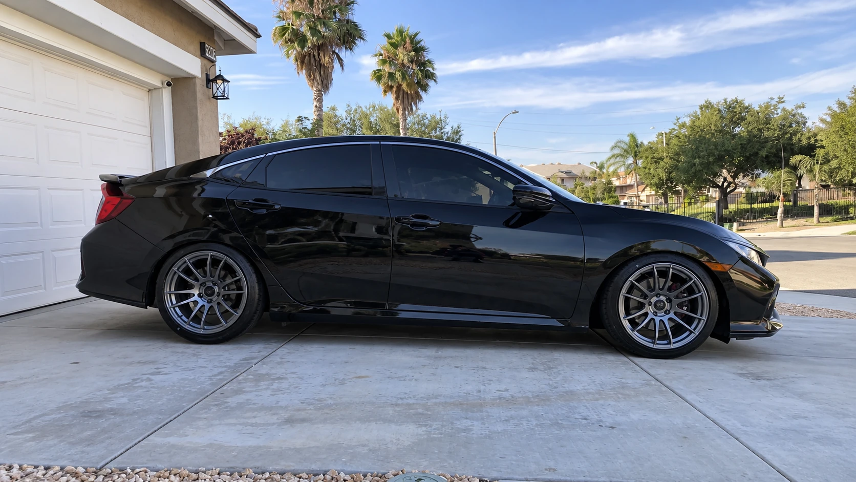 AI-generated view of a 2018 Honda Civic Si Sedan with Avid.1 AV-20 wheels