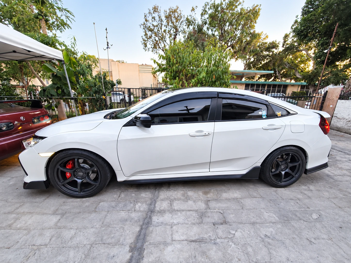 AI-generated view of a 2017 Honda Civic Si Sedan with Avid.1 AV-26 wheels
