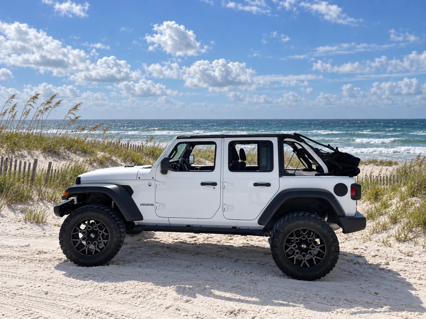 AI-generated view of a 2018 Jeep Wrangler Unlimited Sport S with KMC XD831 Chopstix wheels