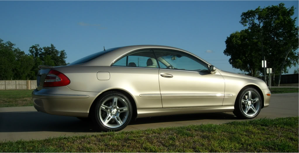 AI-generated view of a 2004 Mercedes-Benz CLK320 Coupe with OE Wheels AMG Replica wheels