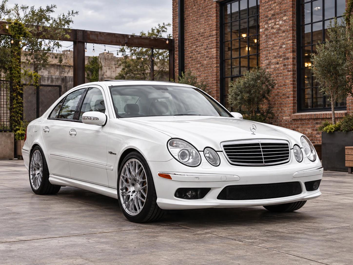 AI-generated view of a 2004 Mercedes-Benz E55 AMG Sedan with Rotiform BLQ wheels