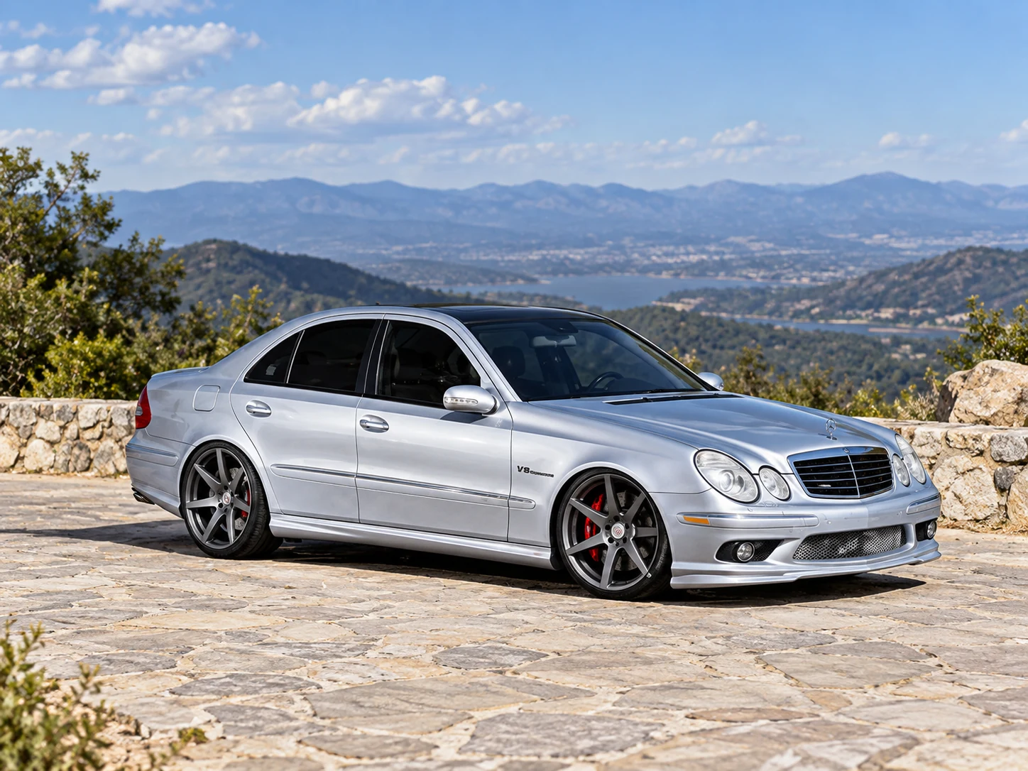 AI-generated view of a 2006 Mercedes-Benz E55 AMG Sedan with Vossen CV7 wheels
