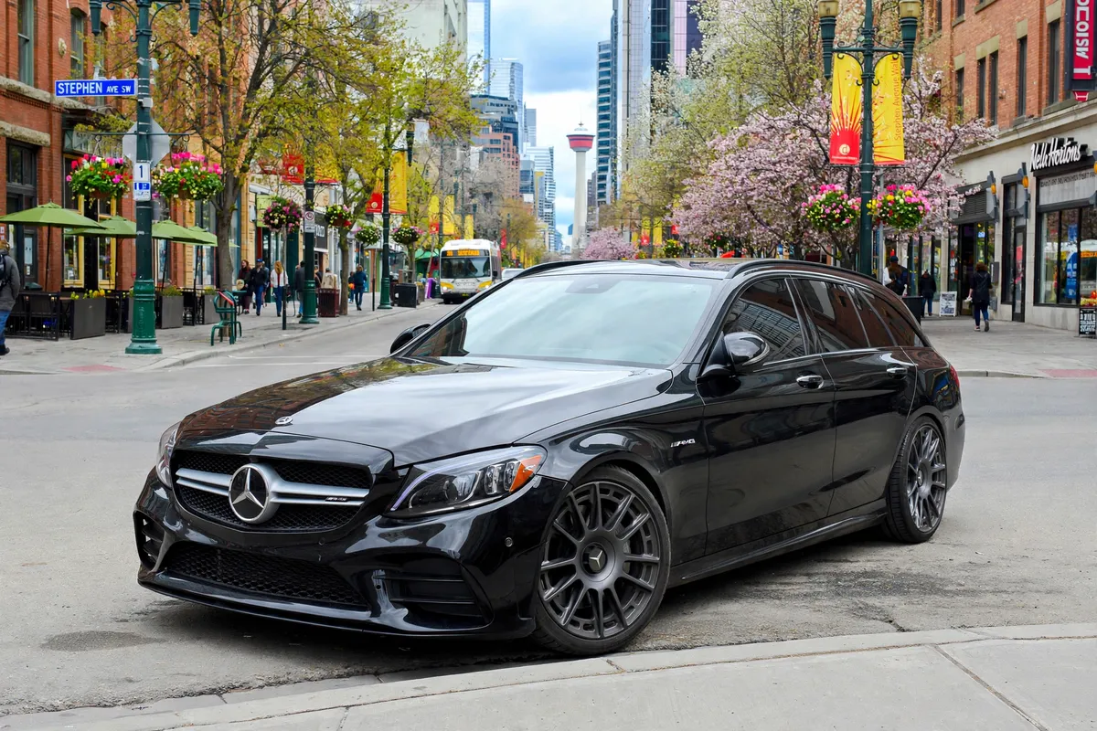 AI-generated view of a 2016 Mercedes-Benz C450 AMG with Rotiform OZR wheels