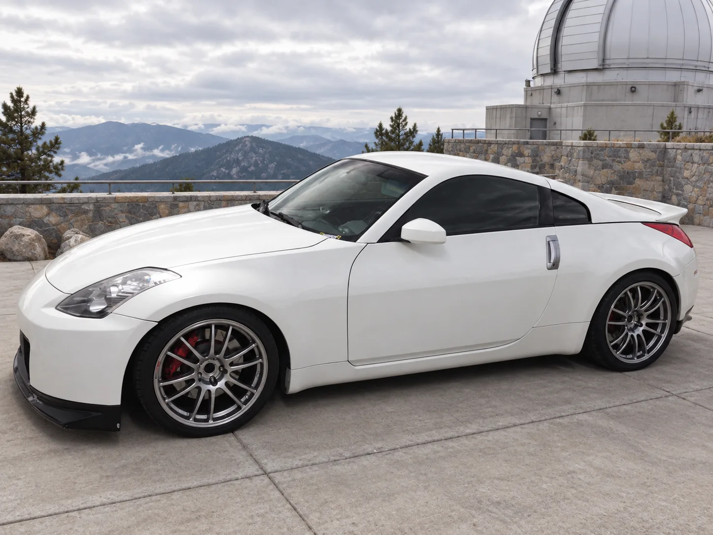 AI-generated view of a 2003 Nissan 350Z Track with Enkei GTC01 wheels