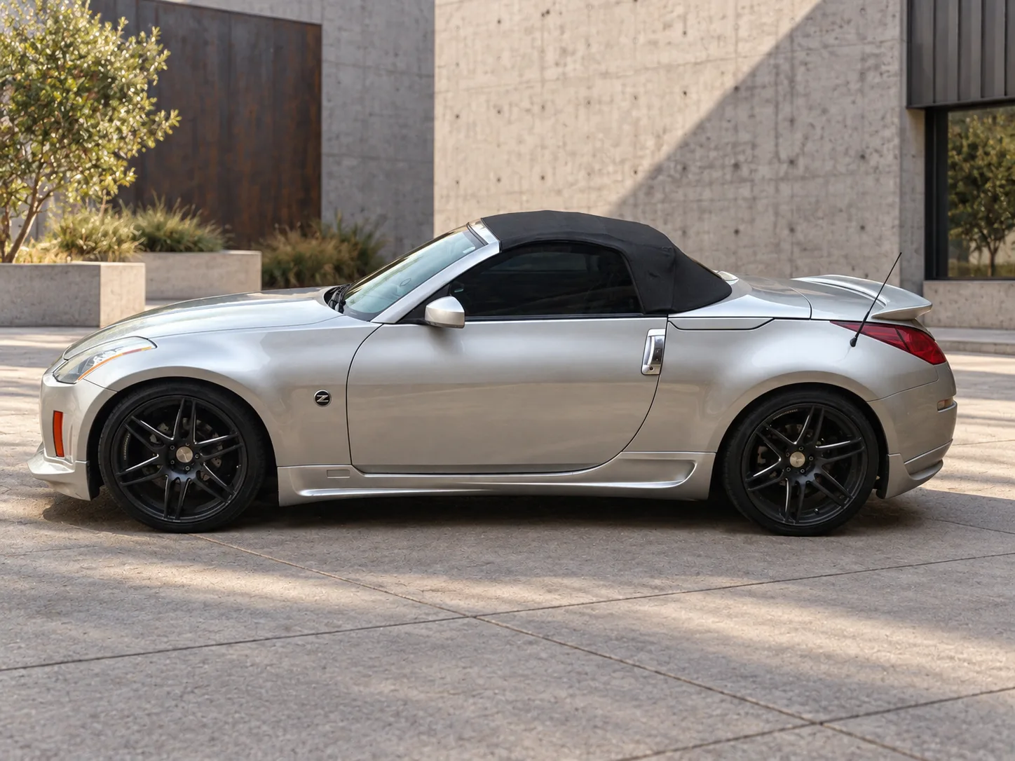 AI-generated view of a 2005 Nissan 350Z Touring Roadster with Avant Garde M368 wheels