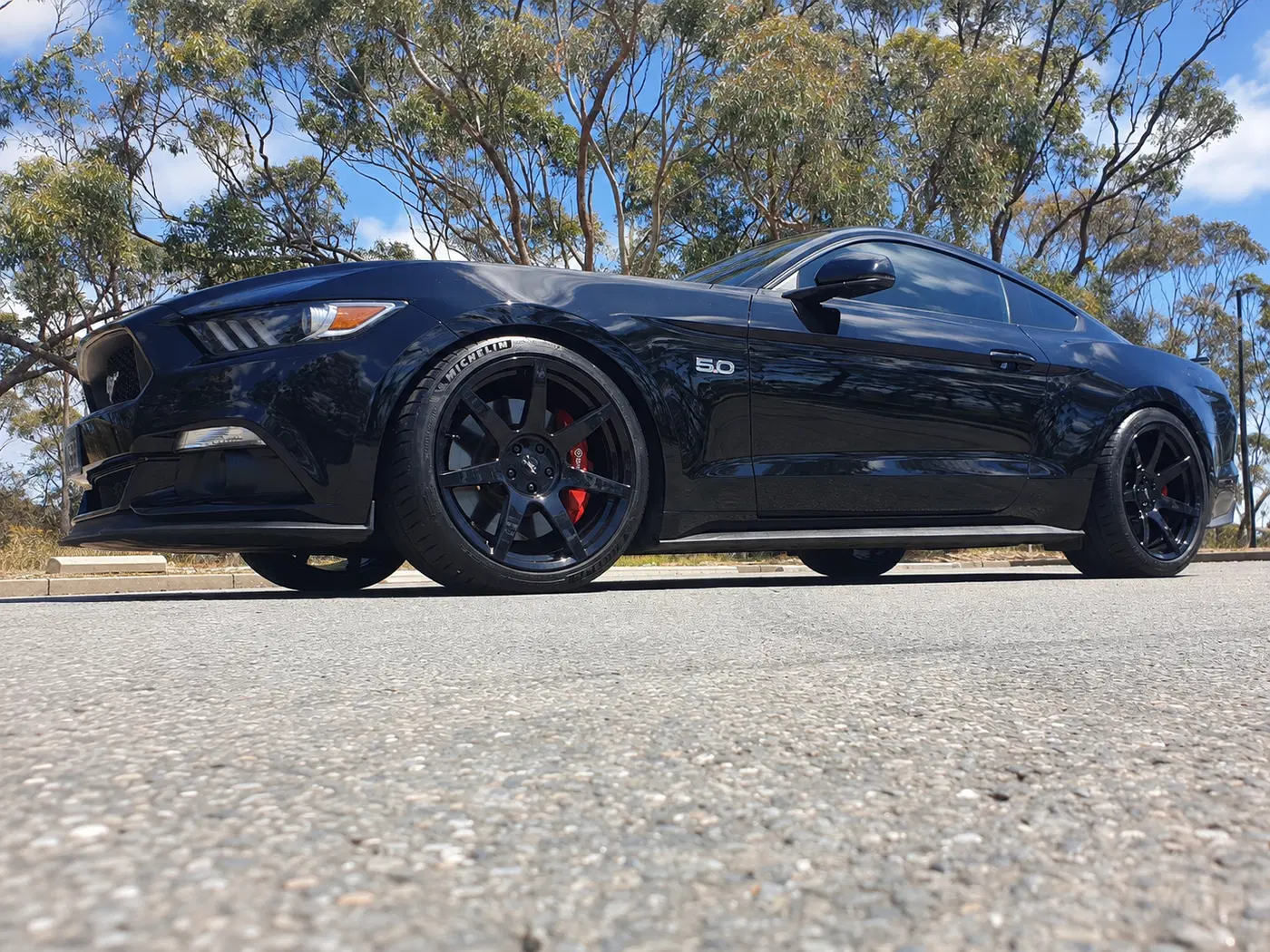 AI-generated view of a 2017 Ford Mustang GT Fastback Auto with Project 6GR Seven spoke wheels