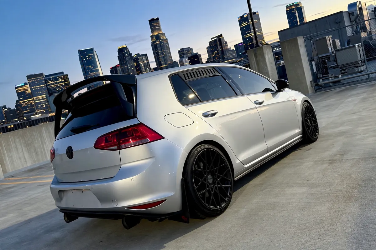 AI-generated view of a 2017 Volkswagen GTI Sport with Rotiform BLQ wheels